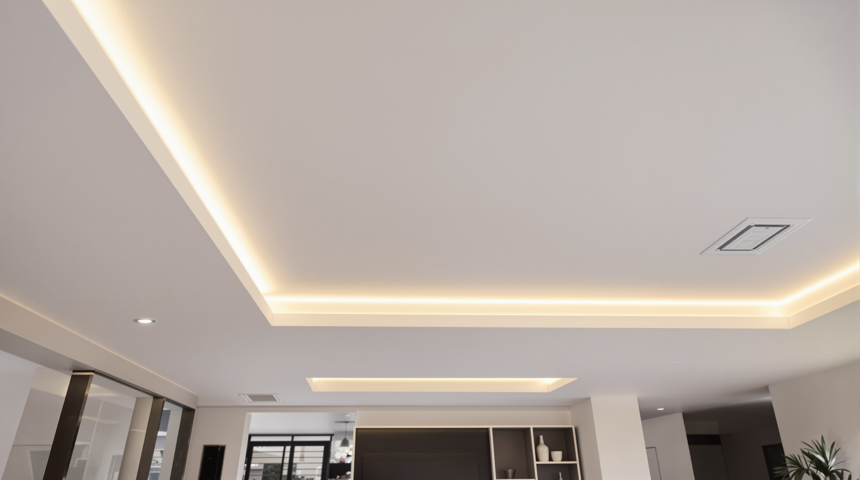 Forro em drywall com rasgos contínuos de iluminação cênica integrada em living de cobertura de alto padrão
